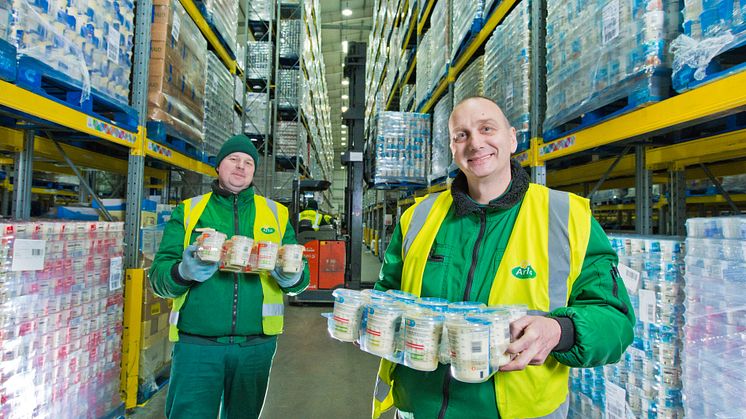 Mindaugas	Zutautas and Granville Leach, colleagues at Arla's National Distribution Centre in Leeds, surrounded by pallets of cream