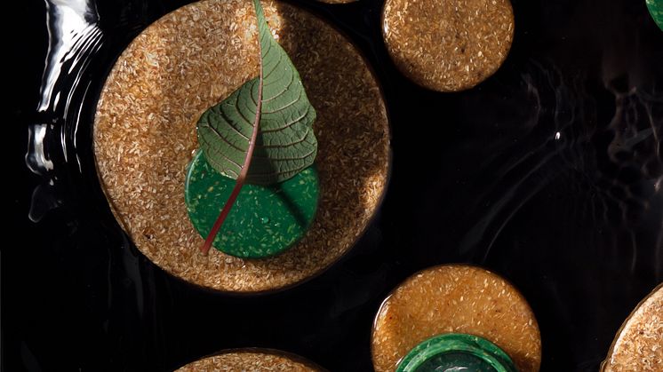 Wood chips from side stream create a unique look for the material