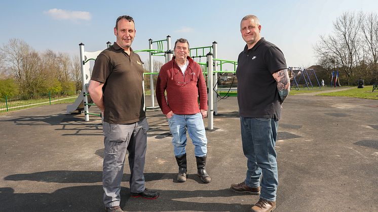 Cllr Alan Quinn (centre) at Dow Lane play area with grounds maintenance team members Dave Sweeney and Kevin Dickinson.