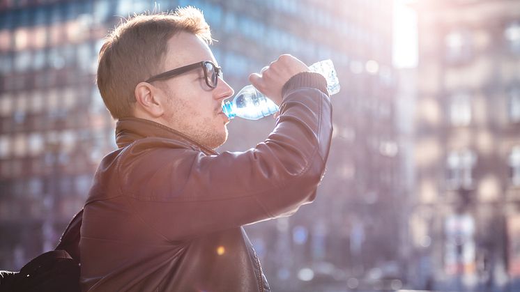 What's in your plastic bottle of water? A new study shows there could be substantial amounts of plastic particles (Credit: iStock Kerkez)