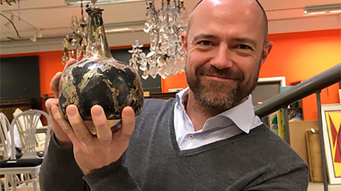 Wine specialist Henrik Christensen with the rare shipwreck wine