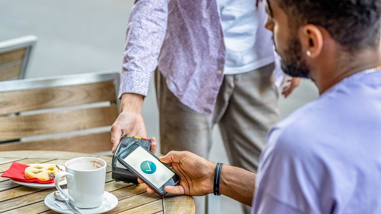 VisaB2B_Payments_Phone_Young_Male_Coffee