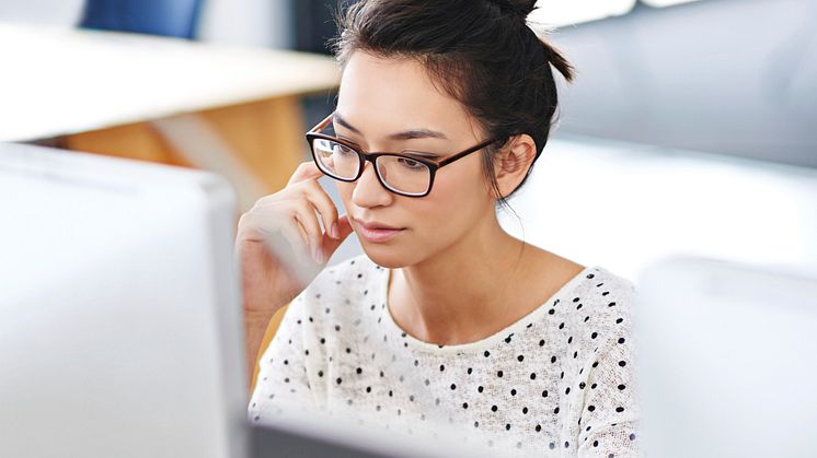 Girl with glasses working on the computer