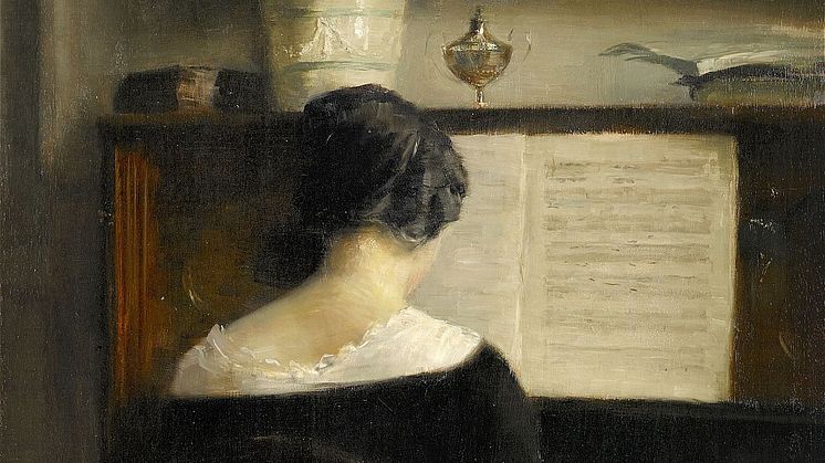 3195. Carl Vilhelm Holsoe, Interiör med dam vid piano Utrop: 180 000-200 000 SEK