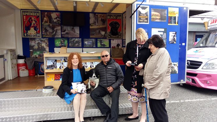 Cllr Jane Black (left) with Pippa the tobacco detection dog on Bury Market