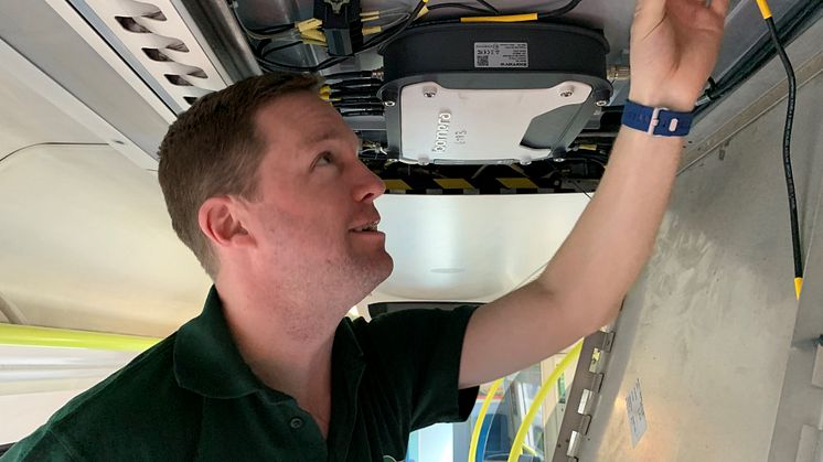 GTR Wireless engineer Robin Hayman fitting wi-fi 3