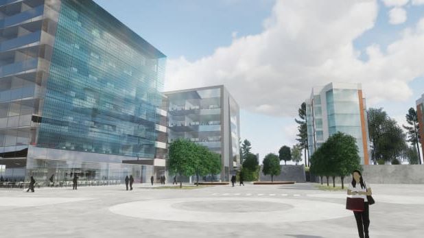 Idéskiss av hur det nya kontorshuset och hyreshusen på Innovatum skulle kunna se ut. Nu pausas projekteringen för studentlägenheterna i väntan på förtydliganden gällande det slopade investeringsstödet.