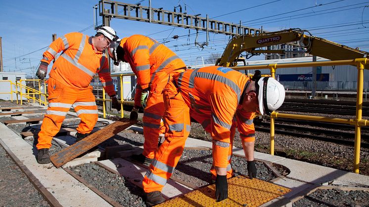 Engineers fitting new cables as part of the East Coast Digital Programme