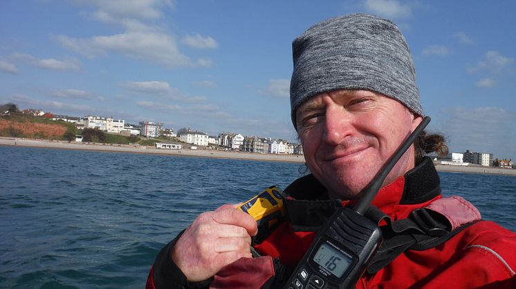 Roy Beal with the Ocean Signal rescueME PLB1 which he will carry on his 900-mile Top Down Kayak Challenge. Photo credit: Roy Beal