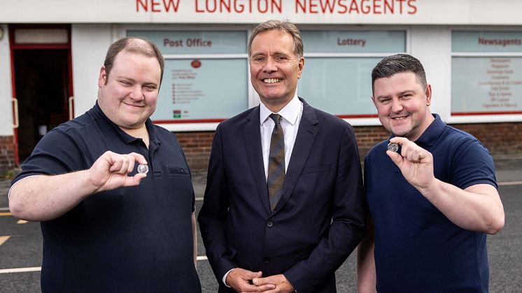 Pride 50p coin roll out. Left to right: Postmaster Daniel Cooper, The Royal Mint's Managing Director, Currency, Andrew Mills and postmaster Nathan Jones 