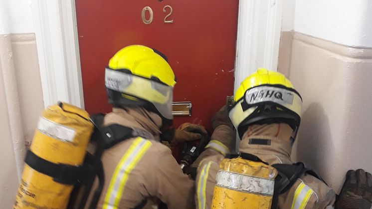 SFRS Firefighters prepare to enter the ng homes property