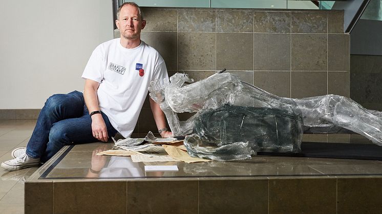 Stewart Hill with his sculpture, on show at Bury Art Museum