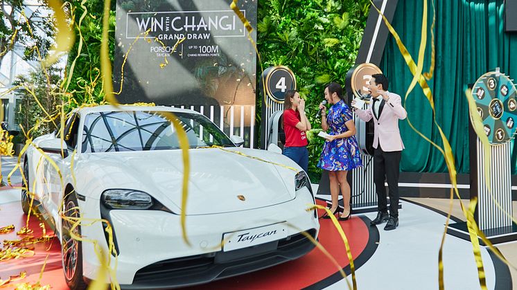 Amanda Marie Siow (left) celebrates with a shower of streamers as she is announced as the Grand Prize winner of the ‘Win With Changi’ campaign