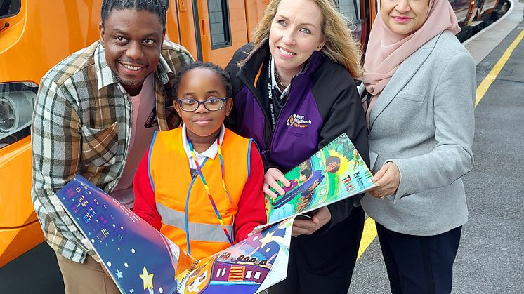 Author Jason Bryan, driver Michelle Nicholson, head teacher Sharifan Nasa and a school child