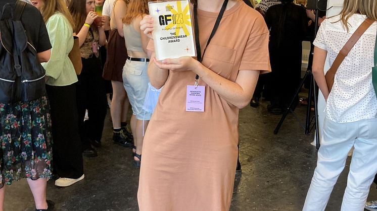Rebecca Frost with her Graduate Fashion Week Childrenswear Award