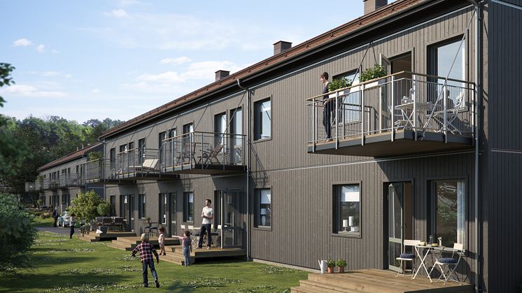 Illustration av trädgårdssida med altaner, balkonger samt gräsytor, BoKlok Krysset i Bålsta. 