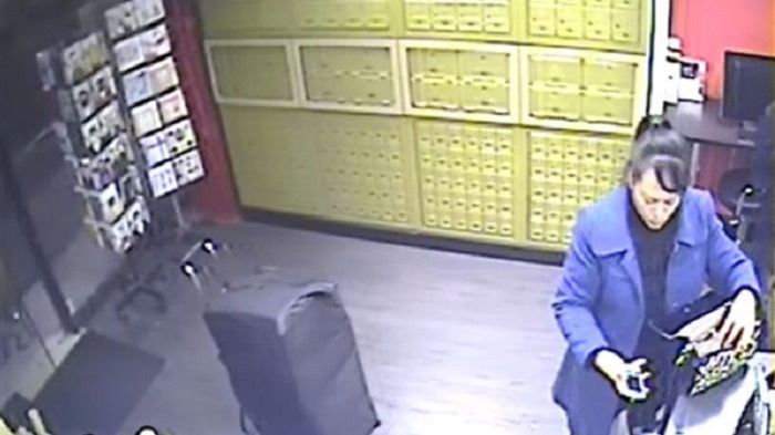 CCTV of Xiou Yu Lin collecting cigarettes LON 04 18