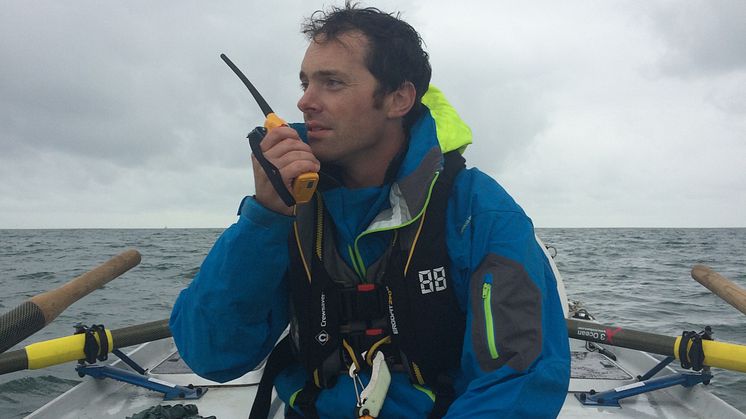Hi-res image - Ocean Signal - Kyle Smith from Talisker Whisky Atlantic Challenge team Carbon Zerow with his Ocean Signal SafeSea V100 VHF handheld radio 