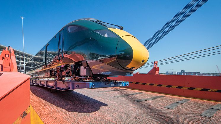 A five car train being offloaded at Southampton port 