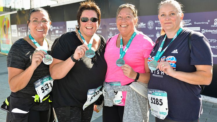 Receiving their medals following the 2016 run were (from left) Pat Jones-Greenhalgh, Delysia Hawley, Janet Spelzini and Lorraine Farr.