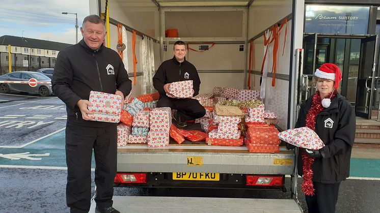 ng homes Regeneration staff Dom, Ronnie and Paula distributing gifts from.jpg