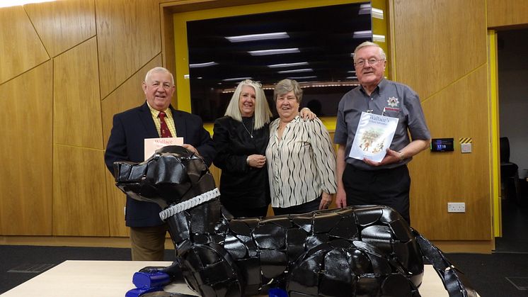 Members of the SFRS Heritage Group with Evelyn Gibson (centre left) and Jean Dallas (centre right) with the Wallace the Fire Dog sculpture.