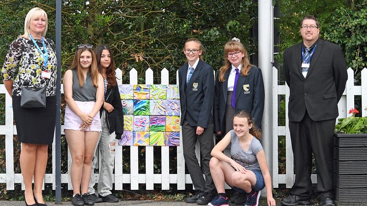 Head of Stations Angie Palmer and Station Manager David Hughes join students from Downham Market Academy who are displaying their art at the station (you can download more pictures below)