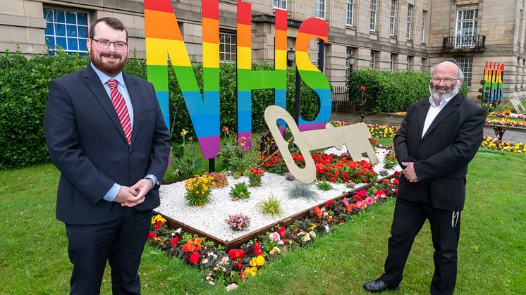 Cllr Eamonn O’Brien and Dr Jeff Schryer outside the NHS/key worker tribute at Bury Town Hall.