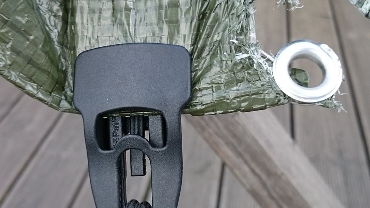 torn_eyelet_green_tarp_fixed_black_midi.jpg
