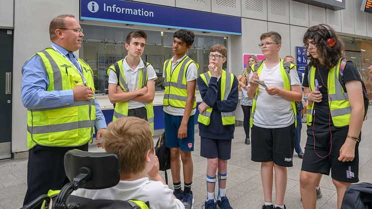 Thameslink Station Manager Steve Lethorn at London Bridge, teaching students from Woodlands Meed School about train travel
