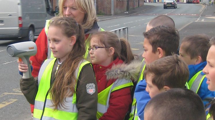 Pupils at Radcliffe Hall CE Methodist Primary School measure the speed of local traffic with Jan Brabin, the council’s senior road safety officer.