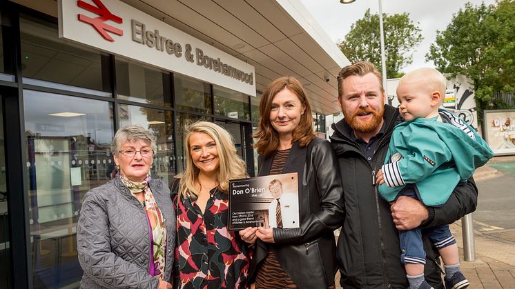 Members of Don O'Brien's family with the memorial plaque Thameslink is placing in the station concourse