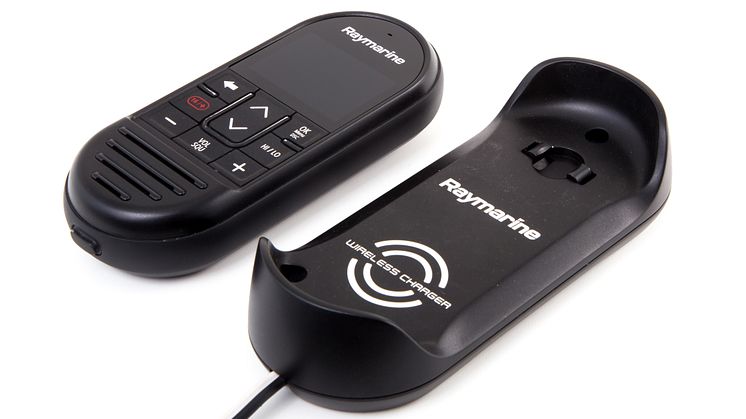 High res image - Raymarine - Wireless handset beside charger
