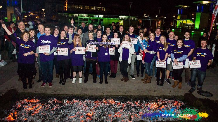 35 people from across Bristol walk over hot coals for stroke