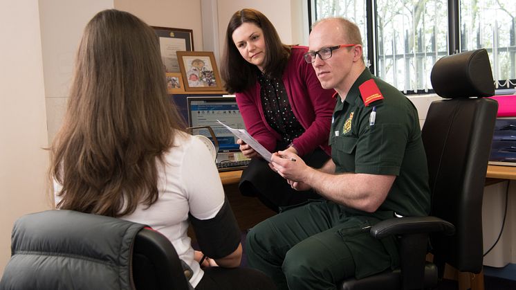 Dr Caroline Jeffery with Advanced Paramedic Wesley Scaife and a patient