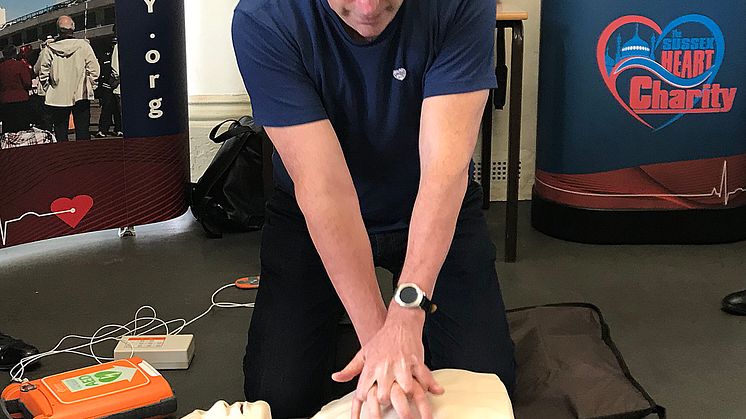 Steve Morris, demonstrating the use of an AED, followed by CPR, in 2018