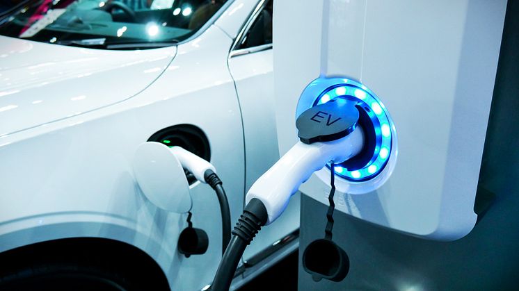 An electric vehicle being charged