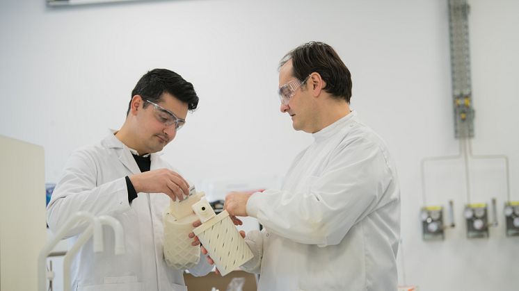 Design Engineer Saqib Ali and Dr Sterghios Moschos look at a prototype of the innovative breath collecting device