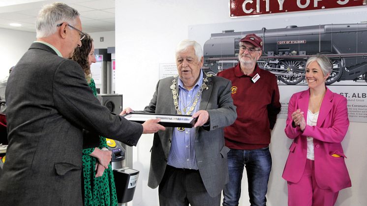 Richard Green presents his miniature mural to the Mayor of St Albans
