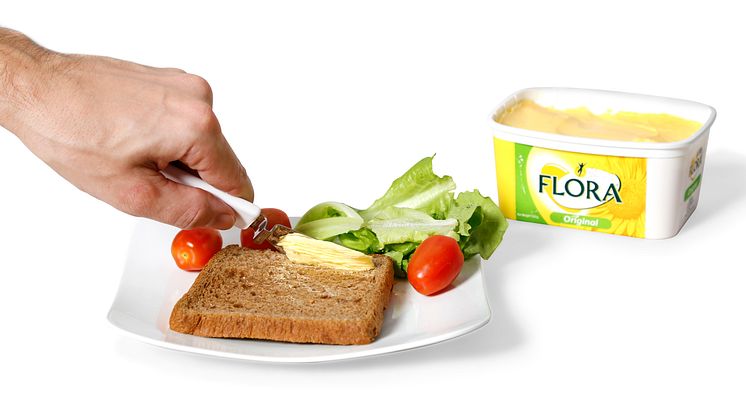 Smörkniv som hänger på kanten