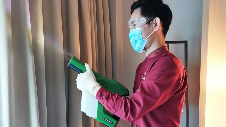 Housekeeping Attendant disfecting guest room at PARKROYAL on Beach Road with the Professional Cordless Electrostatic Handheld Sprayer 2.jpg