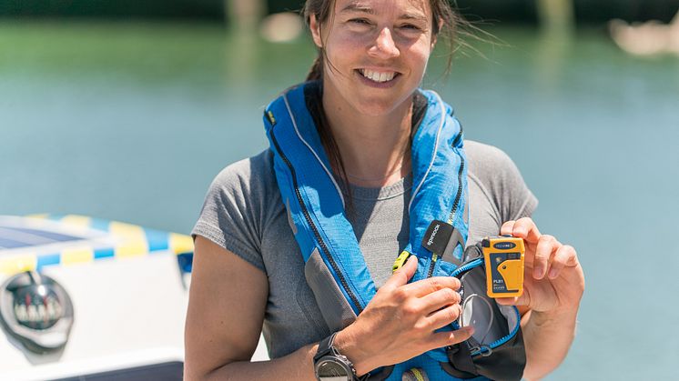 Hi-res image - Ocean Signal - Lia Ditton with the Ocean Signal rescueME PLB1 personal locator beacon