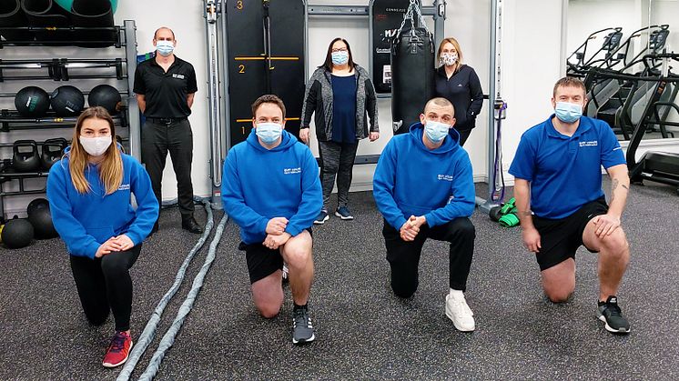 Cllr Andrea Simpson (back, centre) at the new digital-friendly gyms with Mike Taylor and Zilpha Lang, with (front) gym instructors Lizzie, Neil, Ben and Jordan.