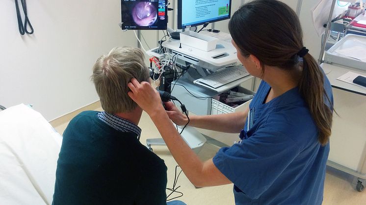 Nurse examines patient with internet connected instruments, so that a doctor in another city can diagnose.