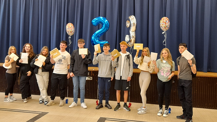 Students at Bury CE High School celebrate their results.