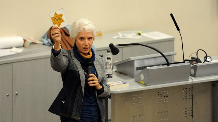 Eva Clarke with a yellow Star of David badge