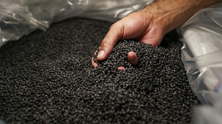 close-up-of-male-hand-holding-plastic-polymer-granules-1024x682.jpeg