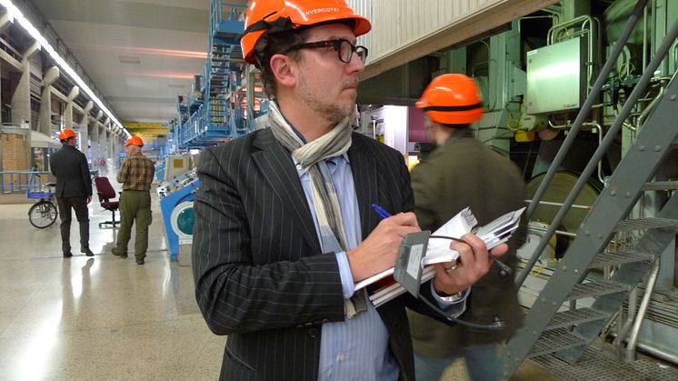 Open CEO David Gray takes notes on Invercote production at Iggesund