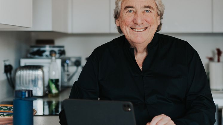 Dave Noble, at workdesk with Bluewater bottle.jpg
