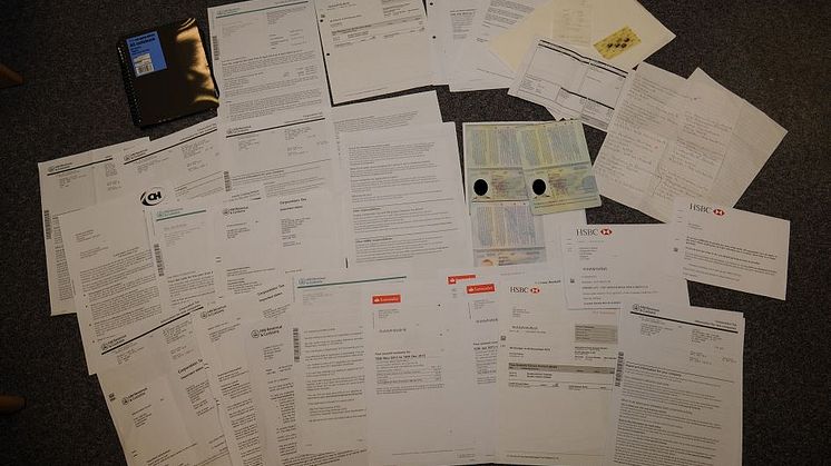 Bank statements for bogus companies and fake passports seized from John Farrell's house